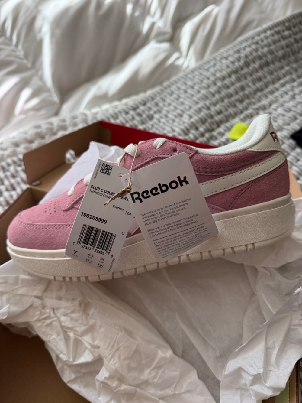 Reebok women’s Pink and White Suede Sneakers
